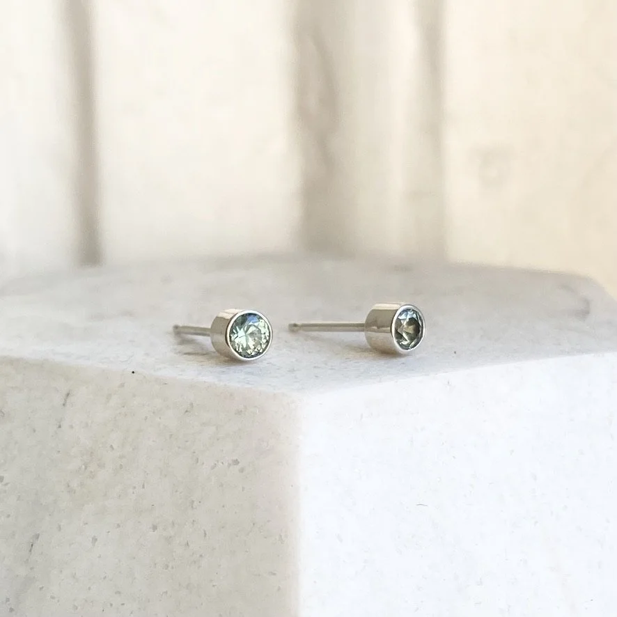 silver green bezel set sapphire studs Kim Drosdick side view on display
