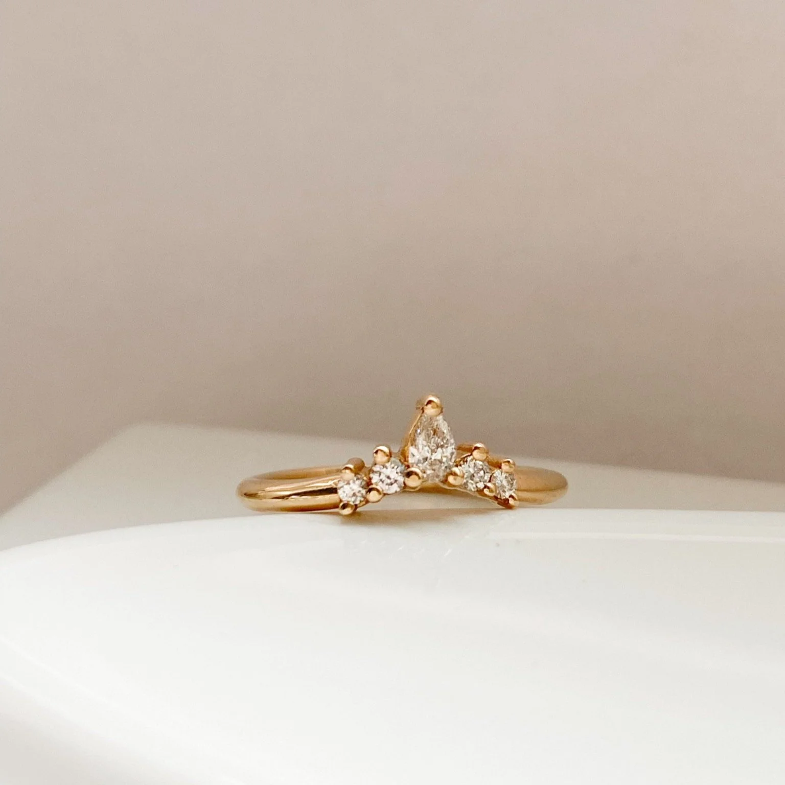 5 stone earth mined diamond tiara wedding ring pear and round shapes 14k recycled yellow gold on dish kim drosdick toronto