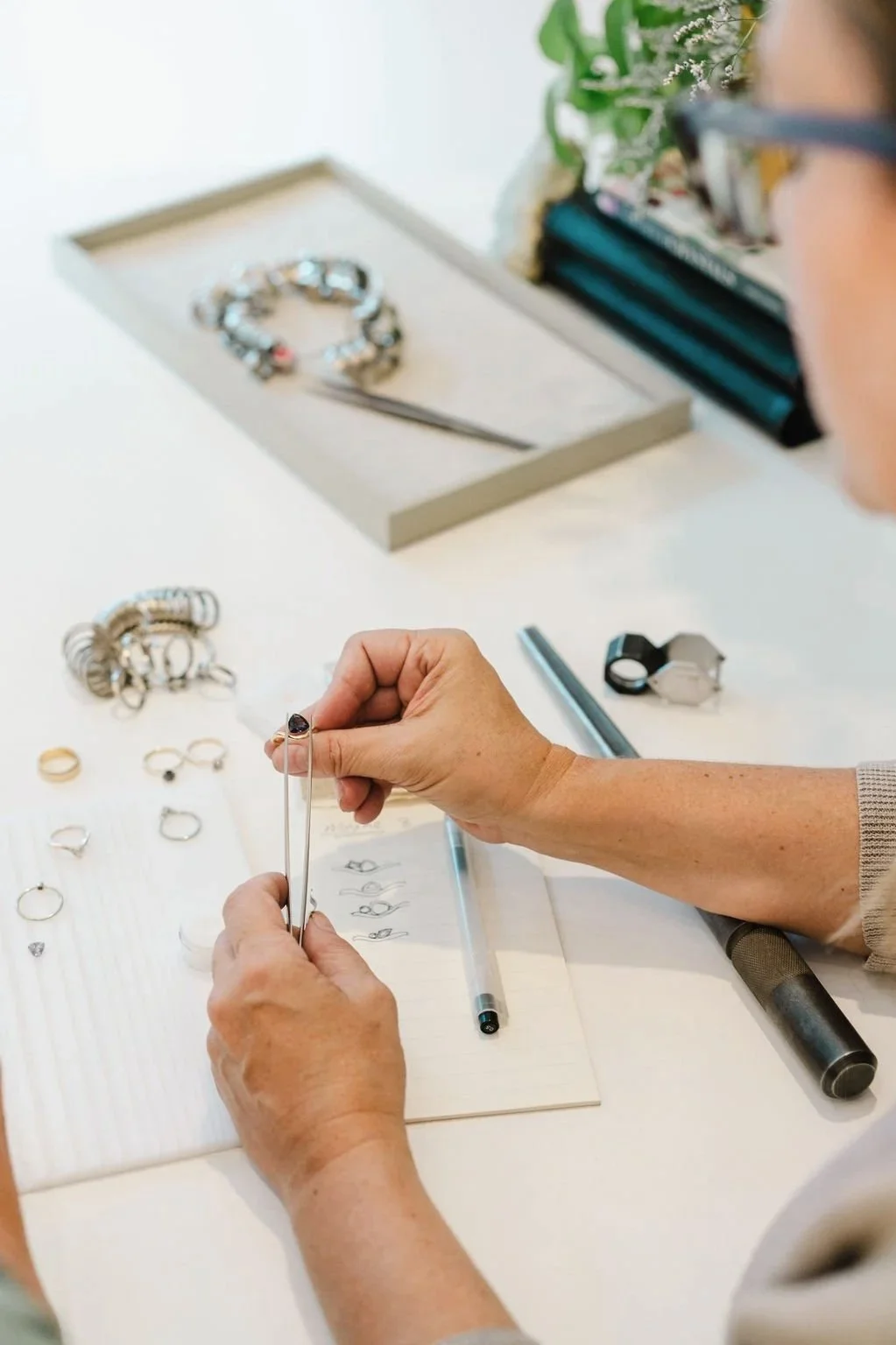 kim drosdick taking noted during a client meeting in her studio boutique in Toroontio