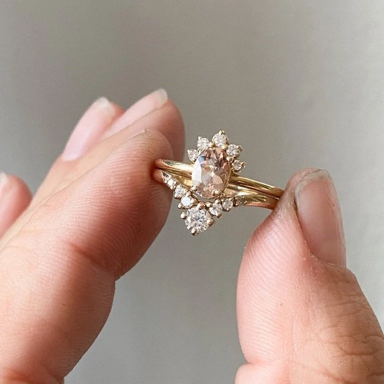 5 stone diamond wedding band 14k yellow gold  contour round brilliant cut colourless Kim Drosdick Jewellery Toronto in hand with matching engagement ring