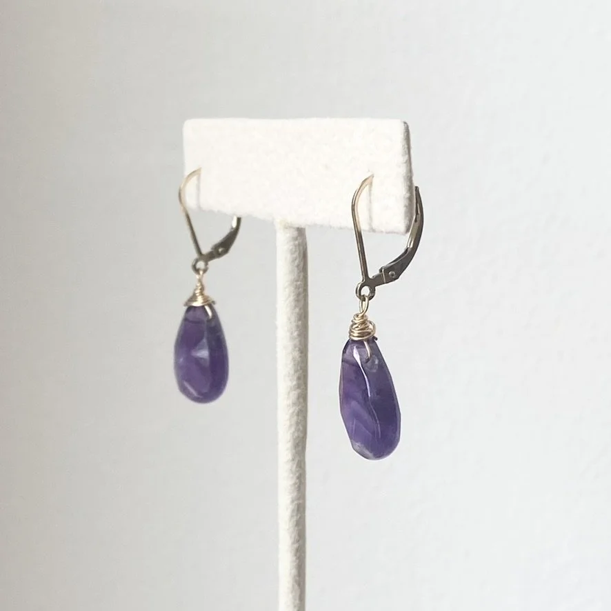 amethyst leverback teardrop earrings with gold filled findings on stand side view
