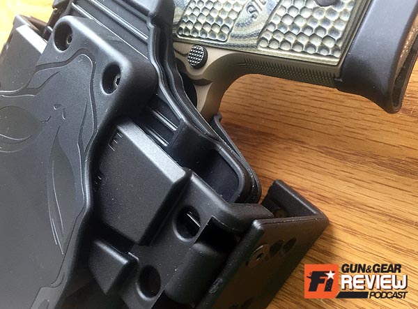 The docking bar's depth can be adjusted for less or more space between the gun and the wall.