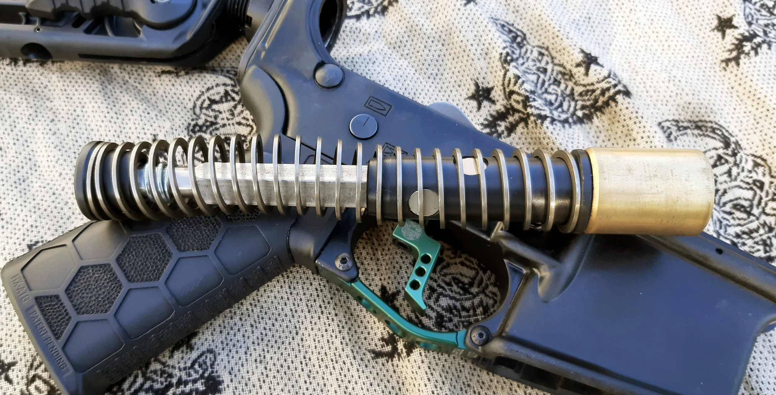 Taccom Delayed Blowback buffer system