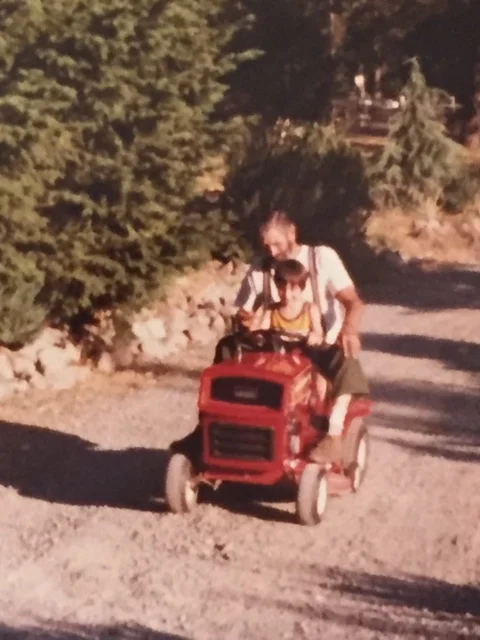 Riding the Tractor with Grandpa Paul .JPG