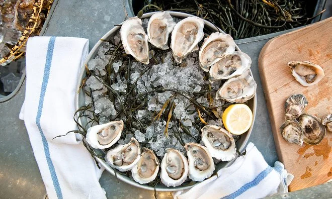 The Floating Oyster Bar Where Chanel Iman, Taylor Schilling, and Aziz Ansari Toast the Summer