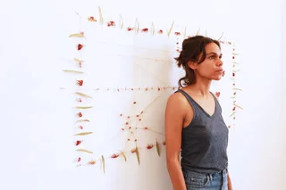 ECU Alumni Katie West in front of her work. Image by kind permission of the artist.