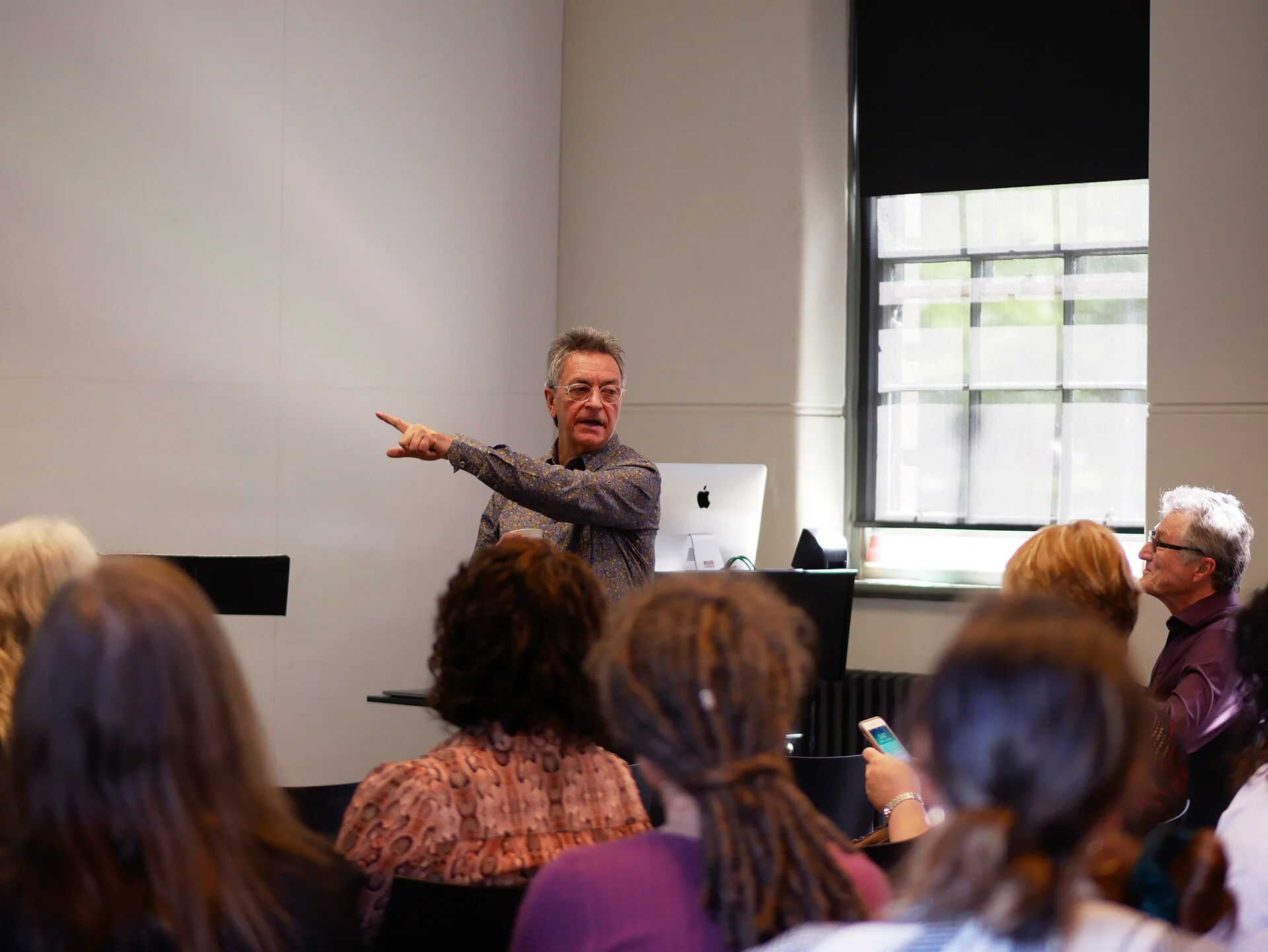 Professor Clive Barstow welcomes attendees and shows the exitS to any potential troublemakers