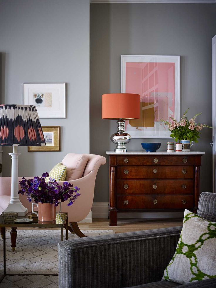 Sitting room designed by Ben Pentreath (benpentreath.cpm): neutral walls with bright cushions, lampshade and artwork to bring in colour