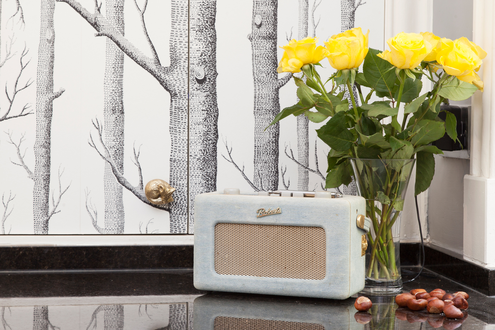 The boiler is now concealed in this cupboard, which is covered in Cole &amp; Sons' Woods wallpaper/Photo: Susie Lowe