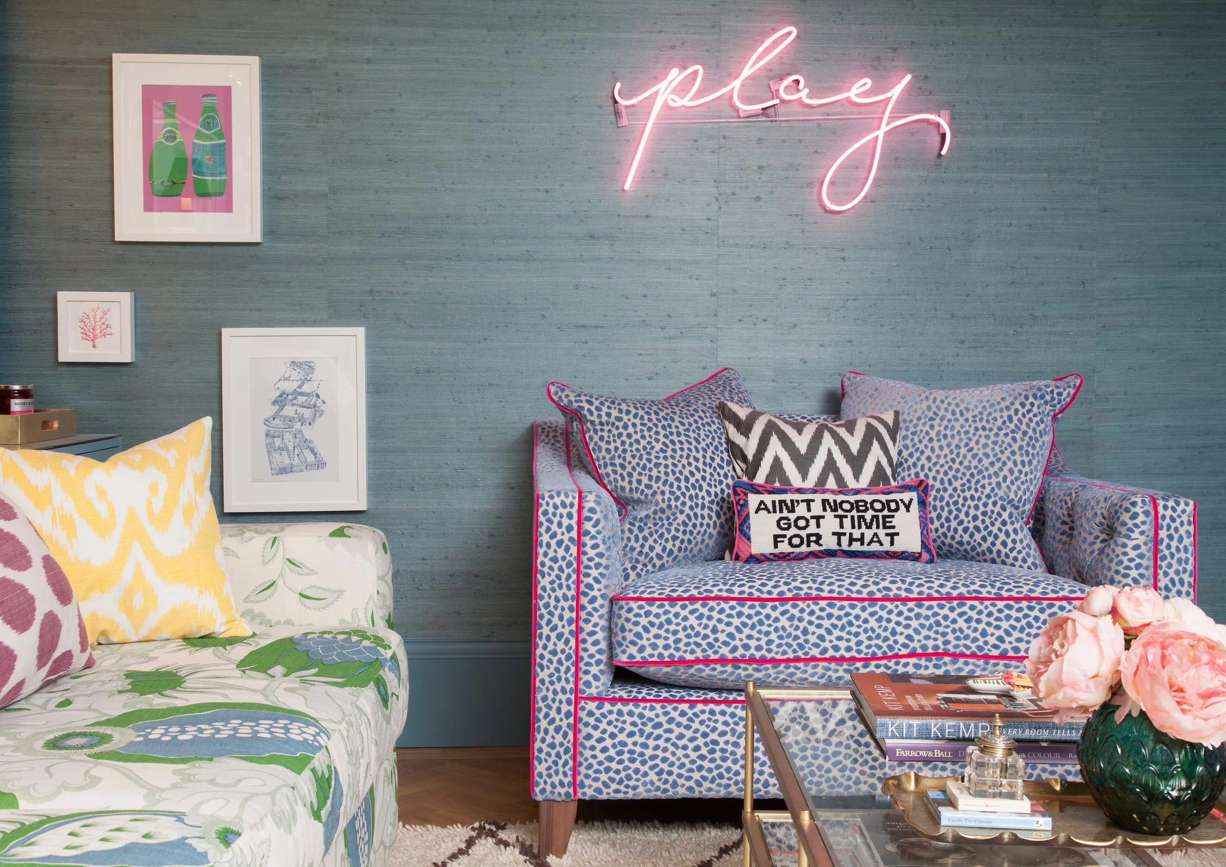 Phillip Jeffries teal grasscloth, pink neon sign, West Elm table