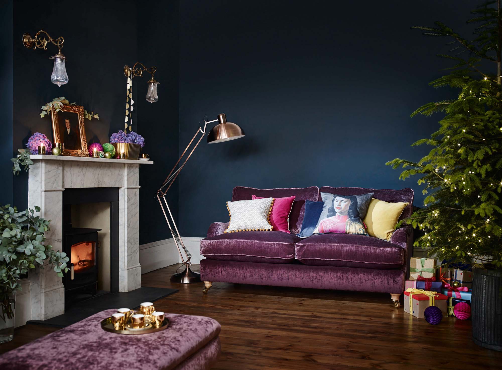 DFS purple sofa and blue walls with Christmas decorations