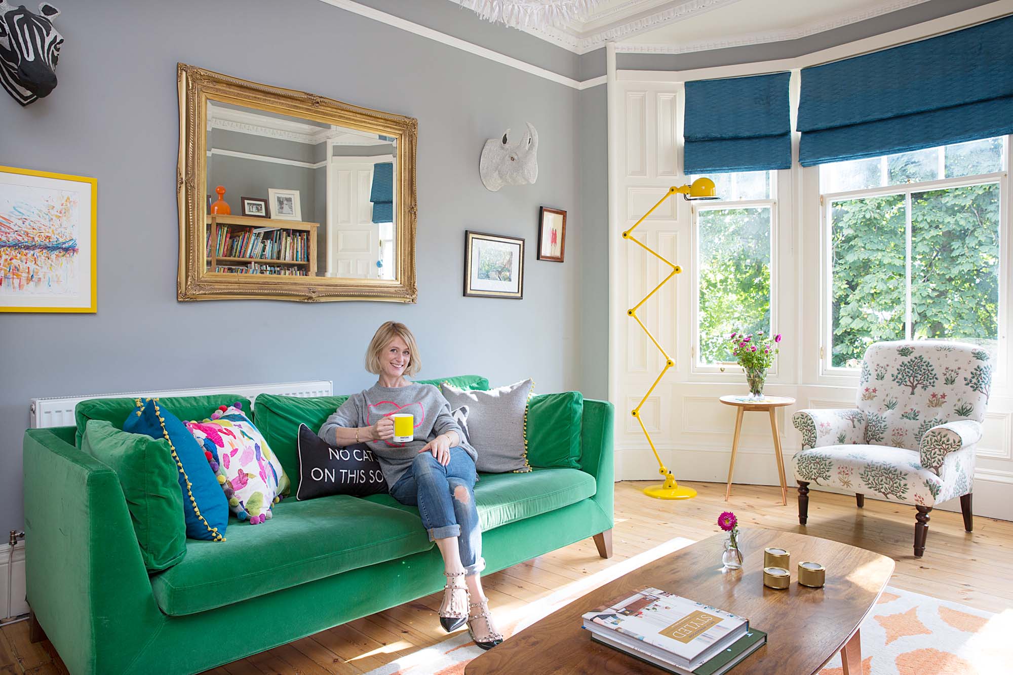 Prepping for a Little Yellow Couch podcast on a Big Green Sofa/Photo: Katie Lee