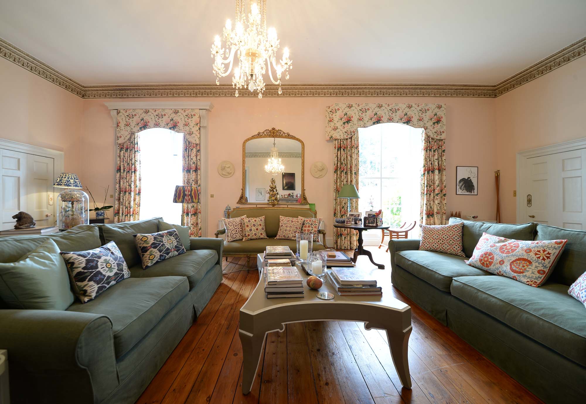 The pink-walled drawing room belonging to Simon Rayner and Jeremy Langmead