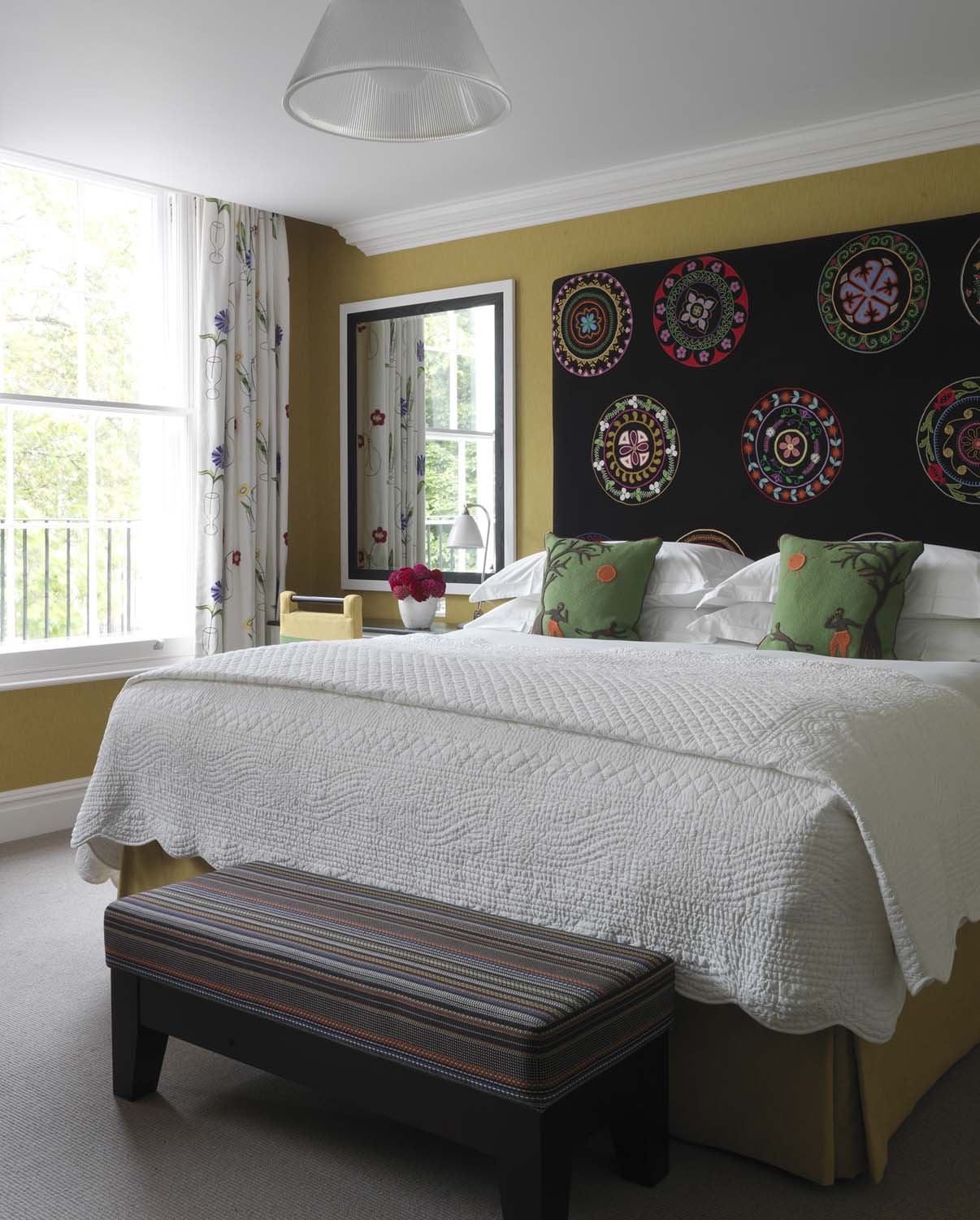 The Dorset Square room designed by Kit Kemp with embroidered headboard