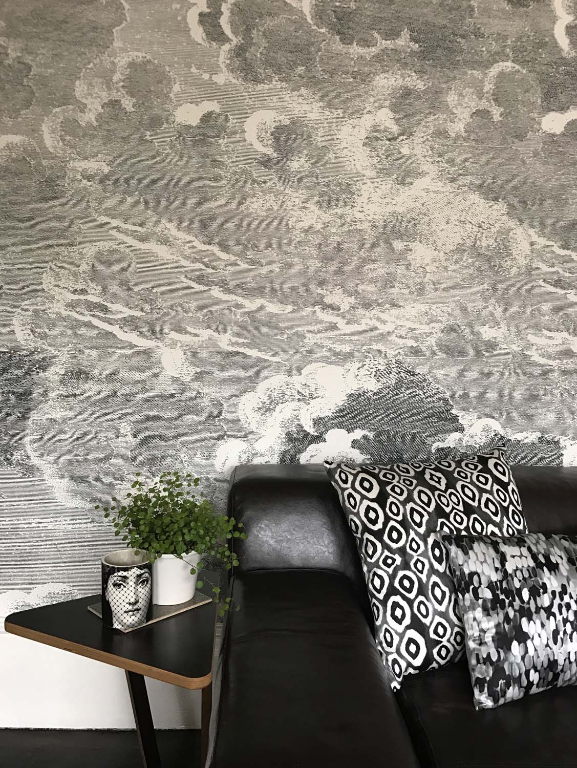 Fornasetti clouds wallpaper in a living room