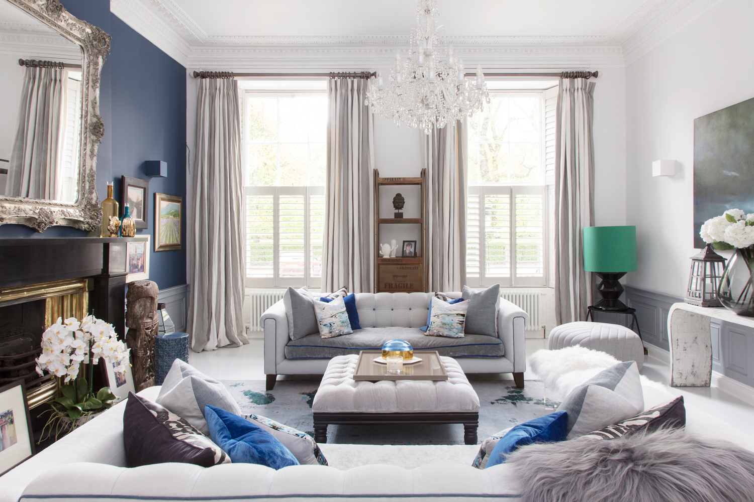 The stunning blue sitting room is filled with PAD decor/Photo: Susie Lowe