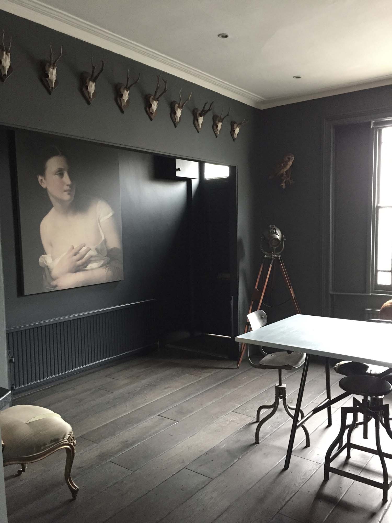 The dining room. 'I like dark a lot,' says Laurie