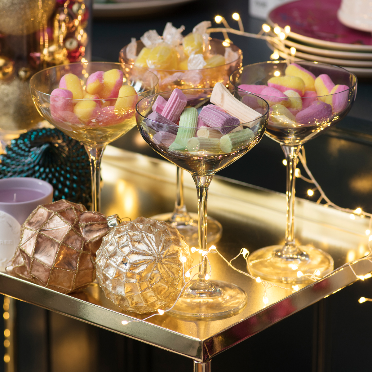 Retro sweets in champagne coupes and Laduree candles for a very sweet Christmas