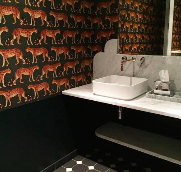 Henrietta Hotel's bathroom with Cole &amp; Son leopard wallpaper/Photo: Kate Watson-Smyth