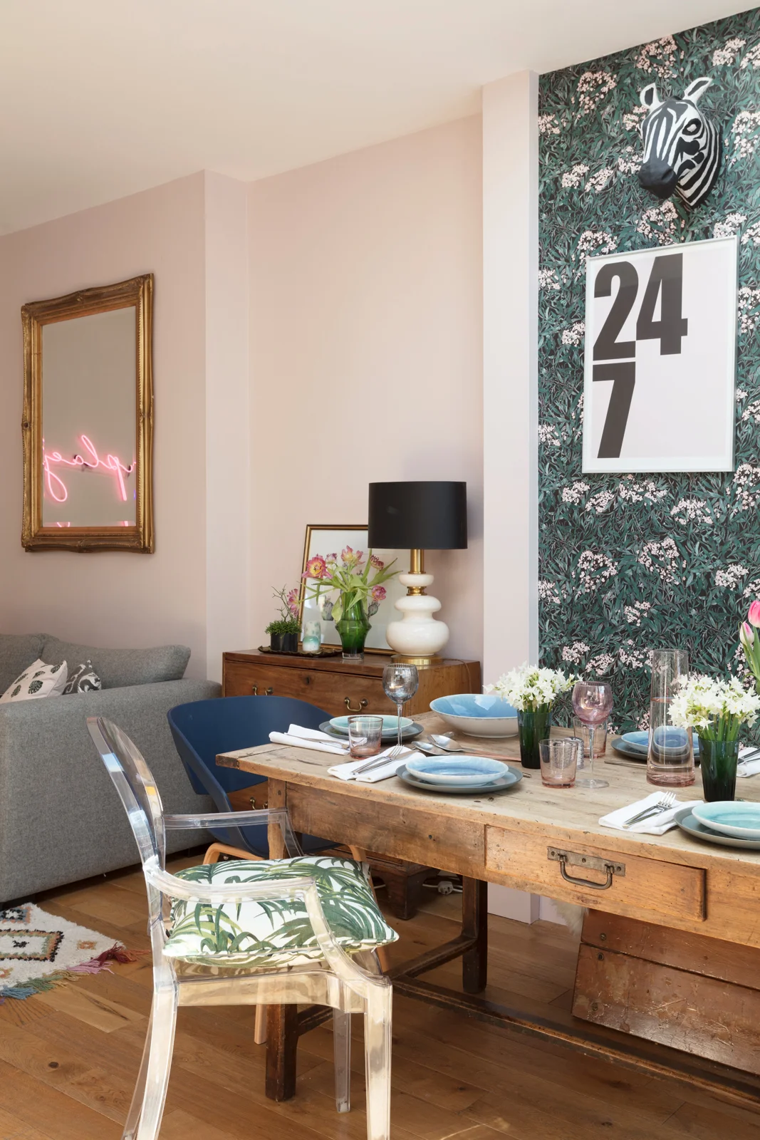 vintage dining table and pink neon sign in the dining room