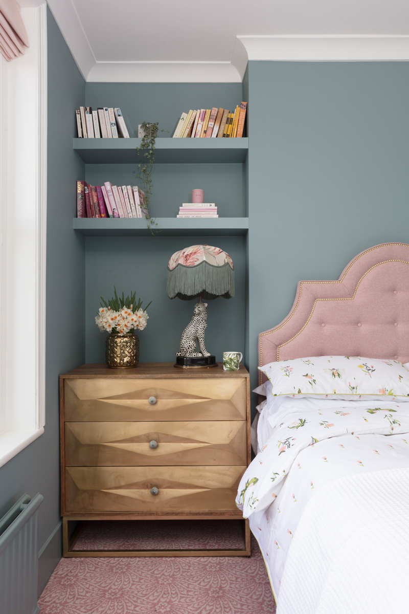 Pink headboard with Farrow & Ball oval room blue walls