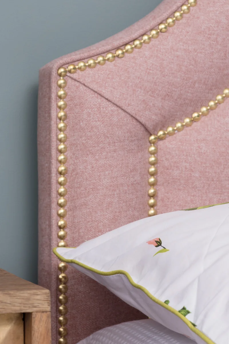 Pink and brass studded bespoke headboard