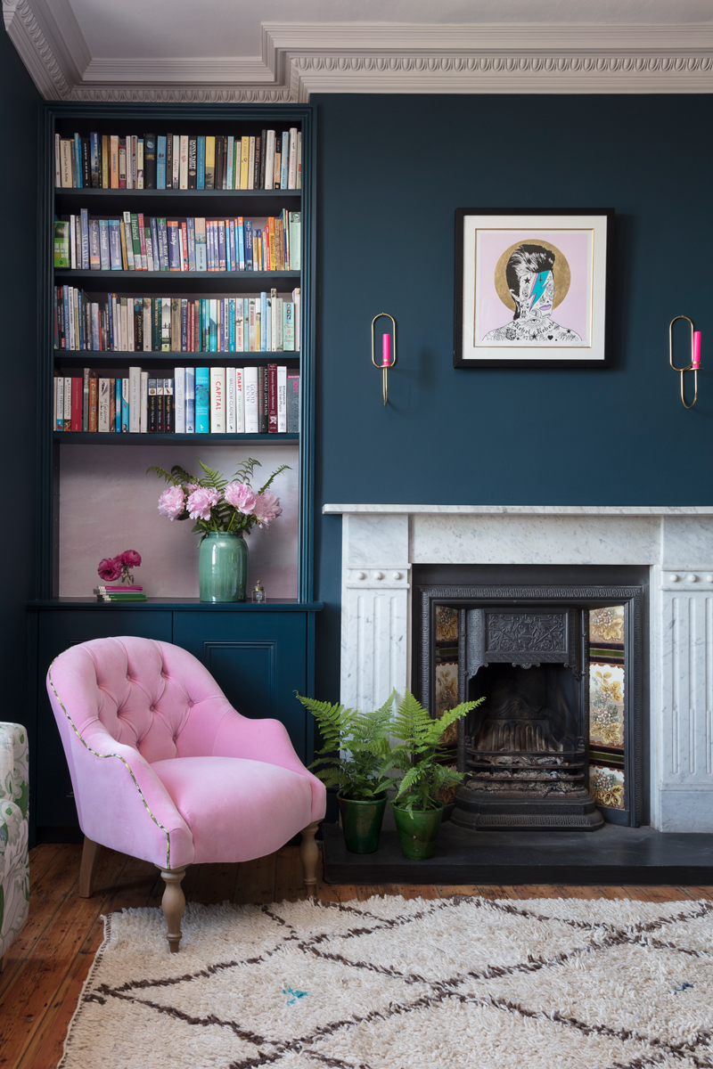 Pink velvet armchair in dark blue Edwardian sitting room