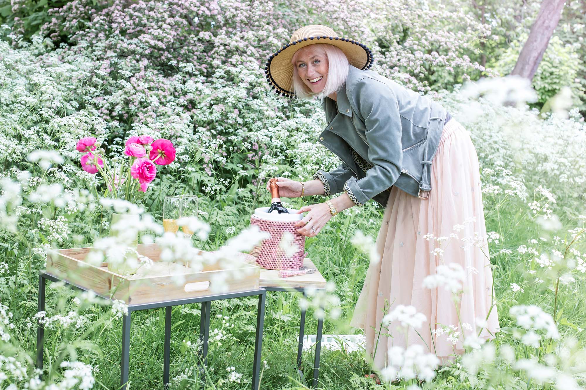 Any brand that has you serving up pink champagne is fine by me | CREDITS: Jacket, hat, tables, all QVCuk.com; ice bucket Kalinko; skirt, Hush | PHOTO: Jane Looker Photography