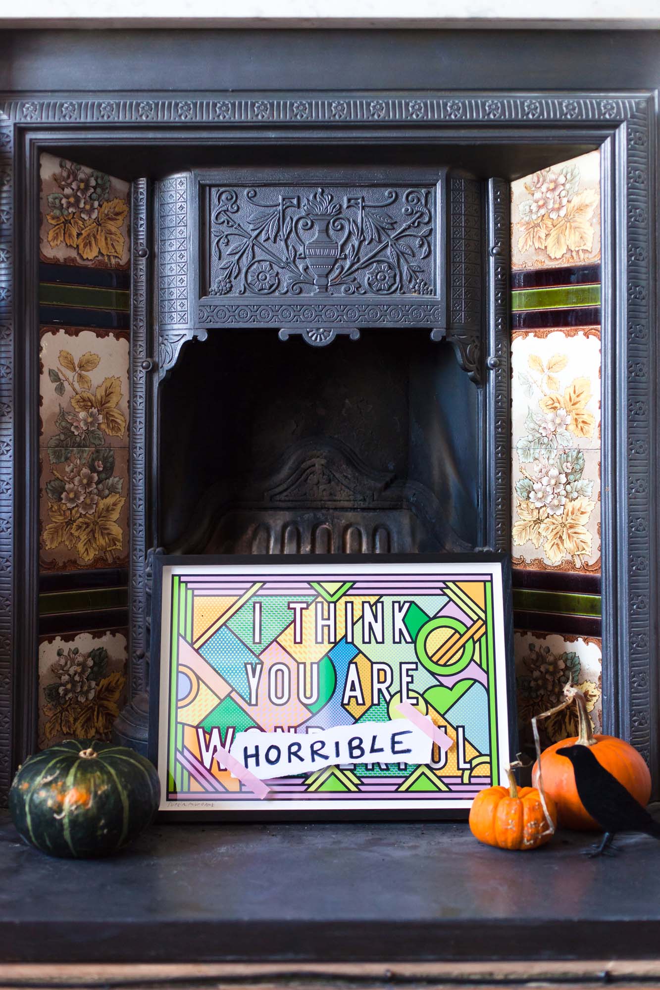 Halloween styled fireplace with pumpkins