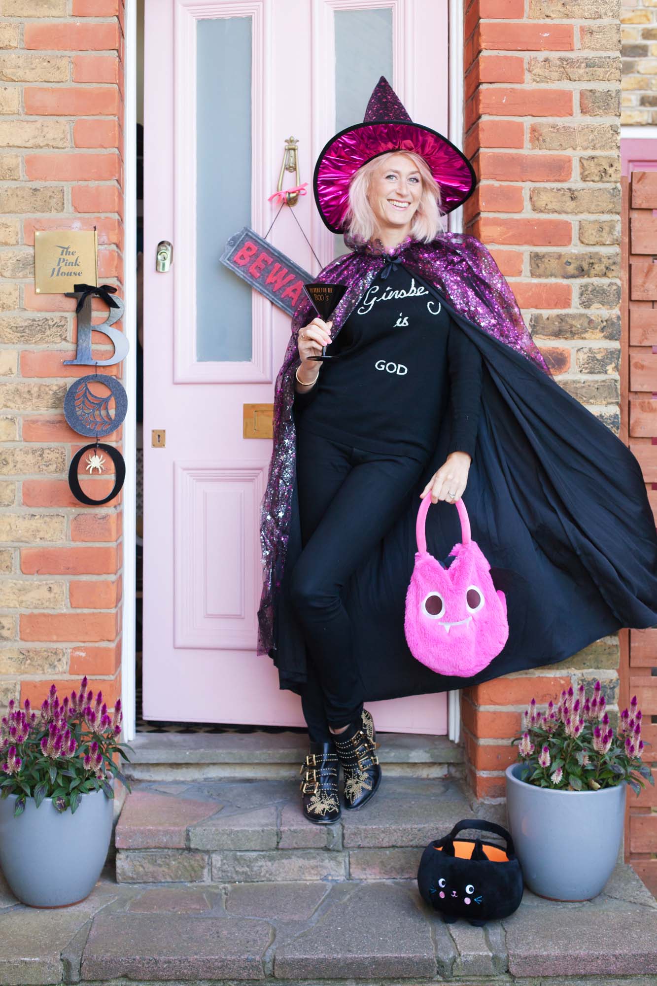Emily Murray from The Pink House in a Sainsbury's Tu pink witch Halloween costume