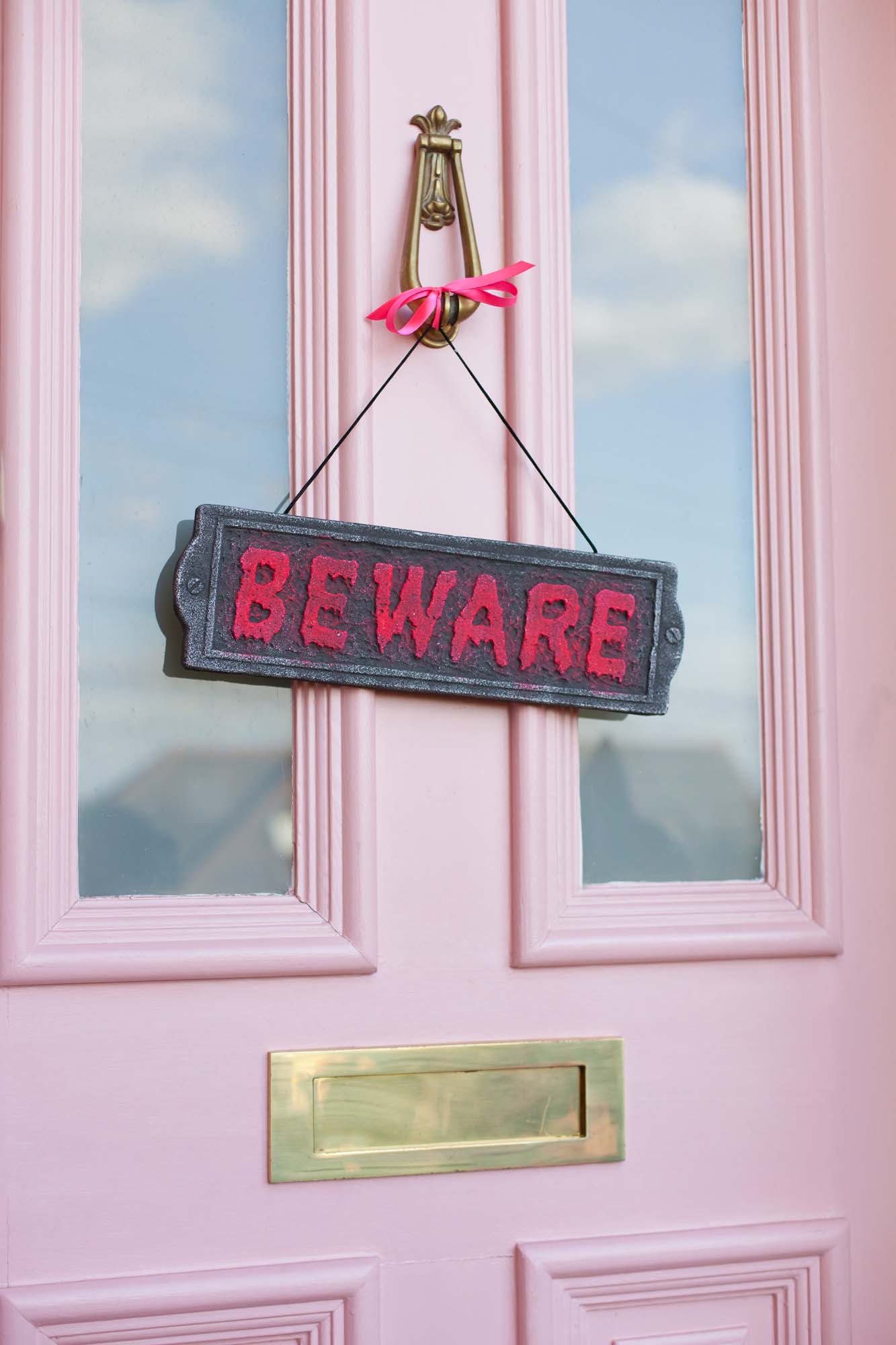 Farrow & Ball Nancy's Blushed pink front door with Beware sign