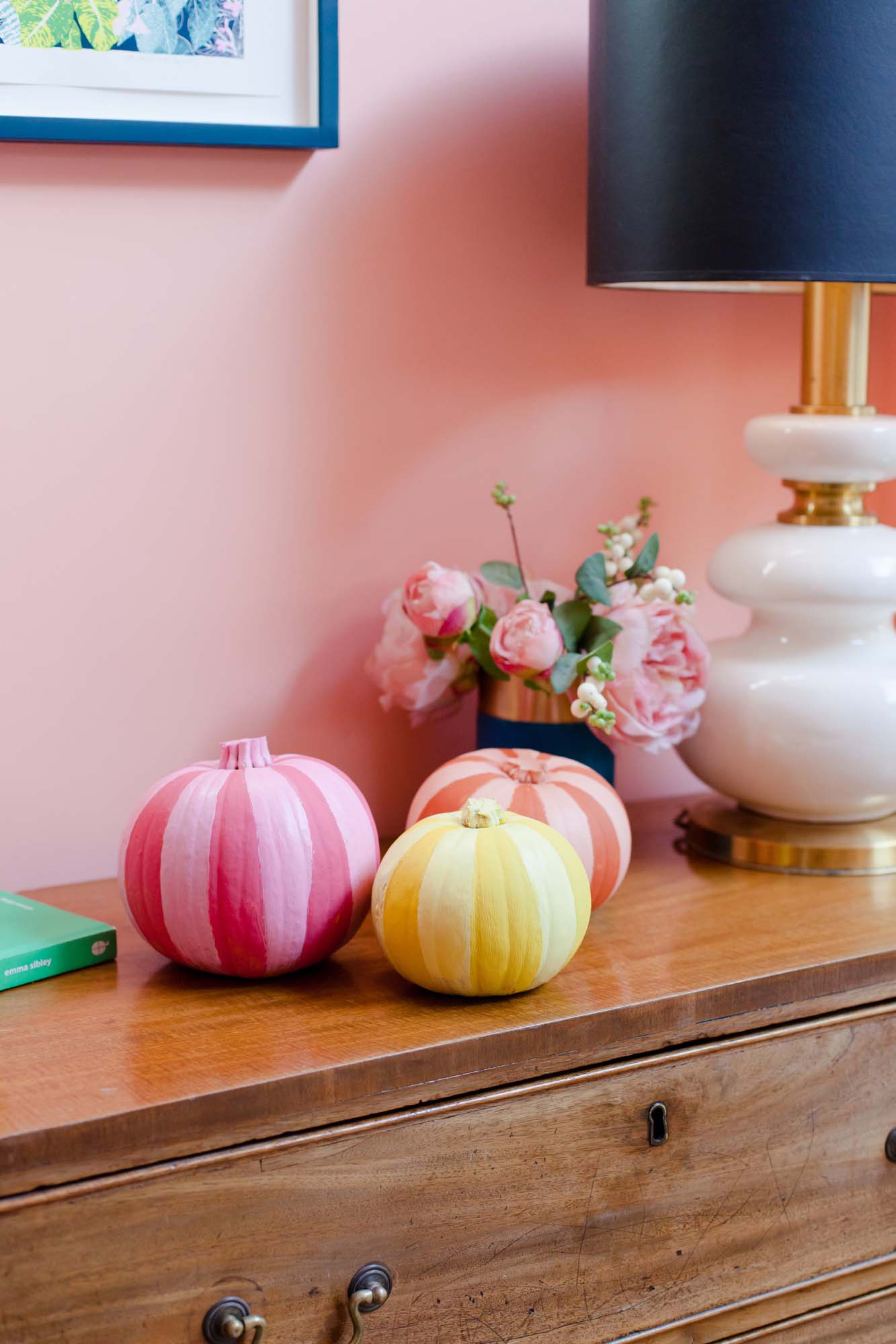 Stripy painted pumpkins in pink, orange and yellow
