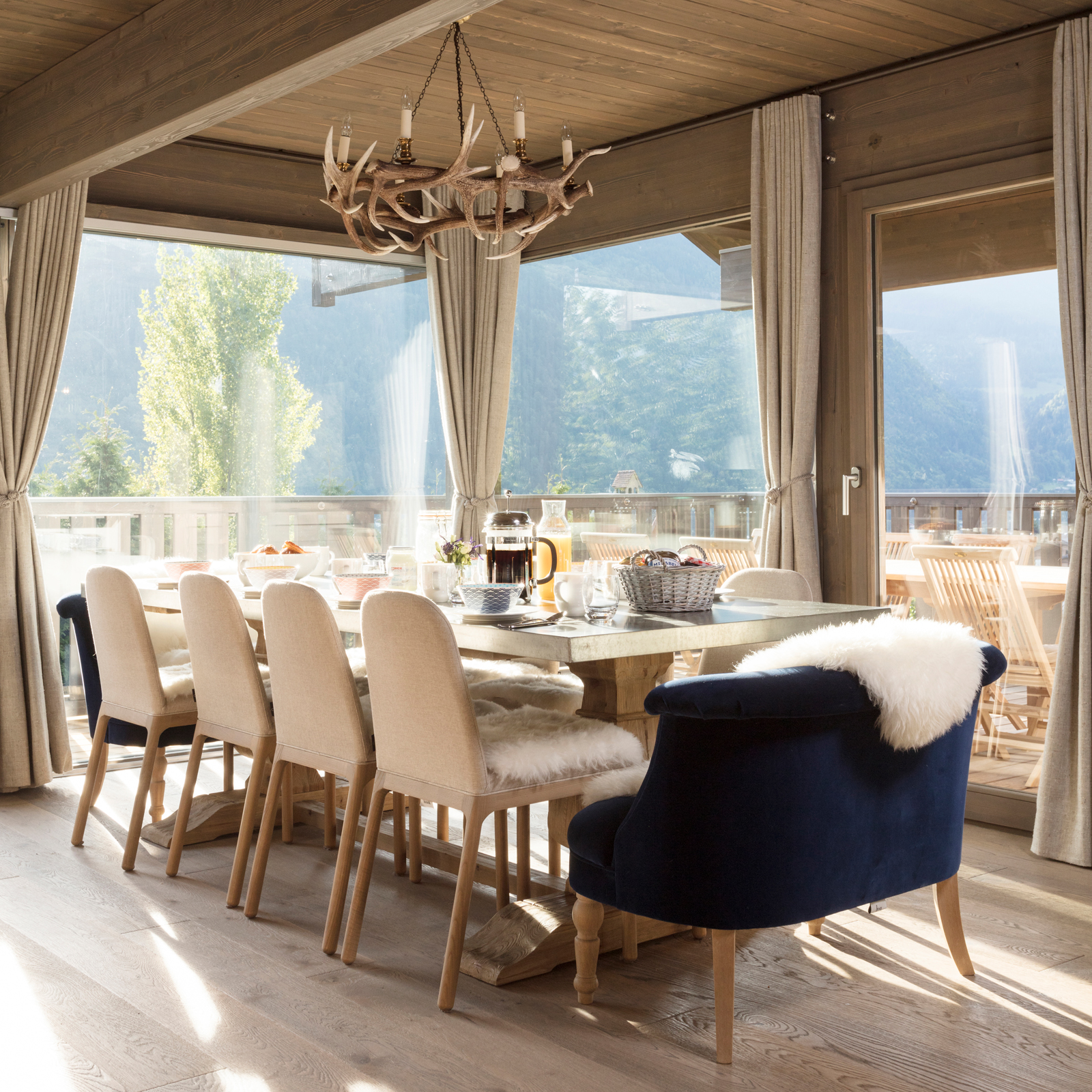 This photo of Chalet Mirabelle’s dining space with beautiful views was taken in the summer - our view was rather more snowy