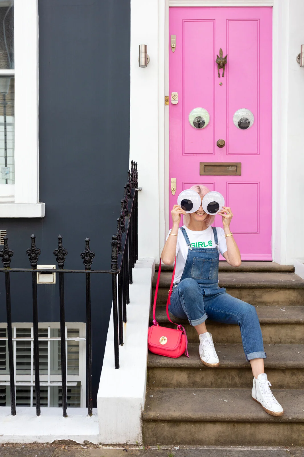 Me, my fave Hill &amp; Friends handbag and a couple of spare googly eyes outside Emma’s amazing pink door