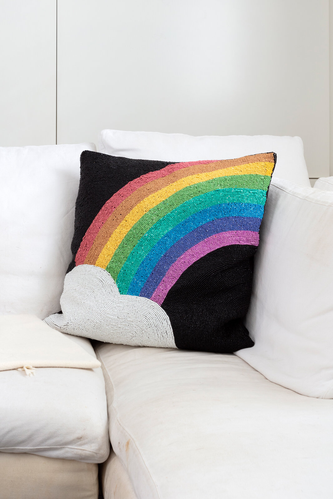 Rainbow beaded cushion