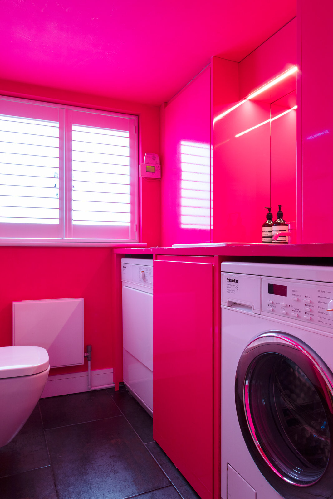 Neon pink utility room cloak room