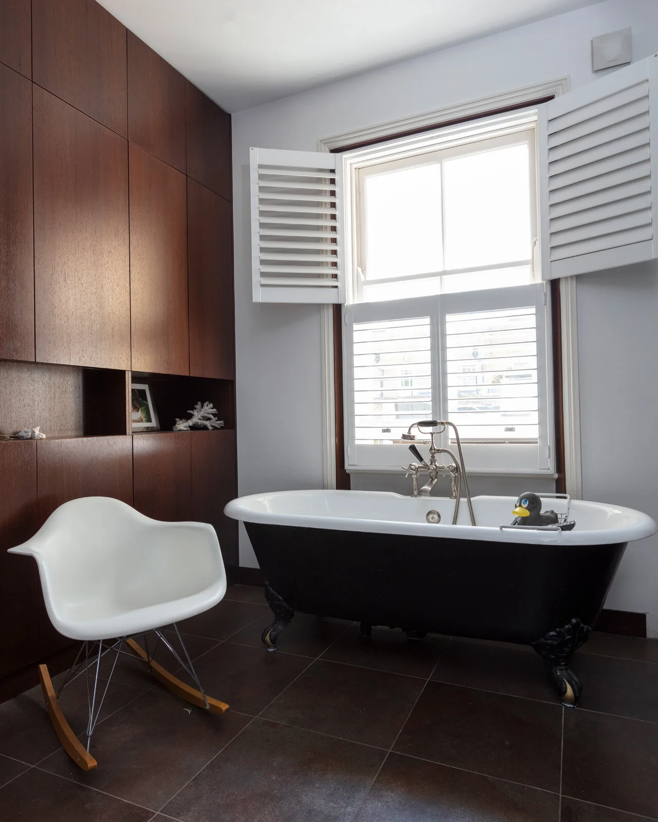 Bespoke bathroom storage and a claw foot bath tub