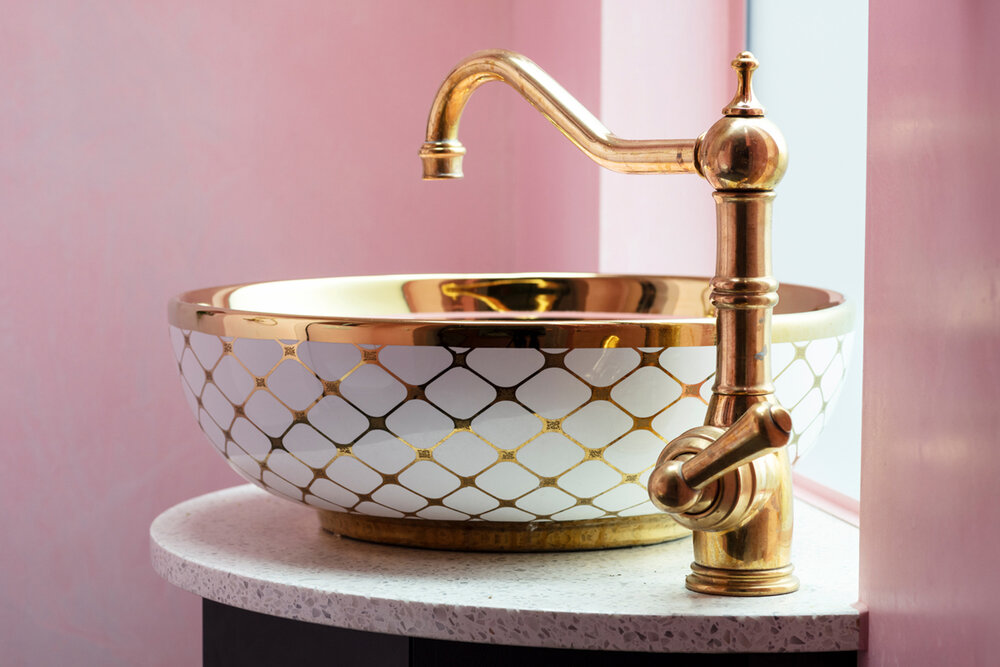 The Perrin &amp; Rowe Aquitaine tap, on a curved Diespeker terrazzo top