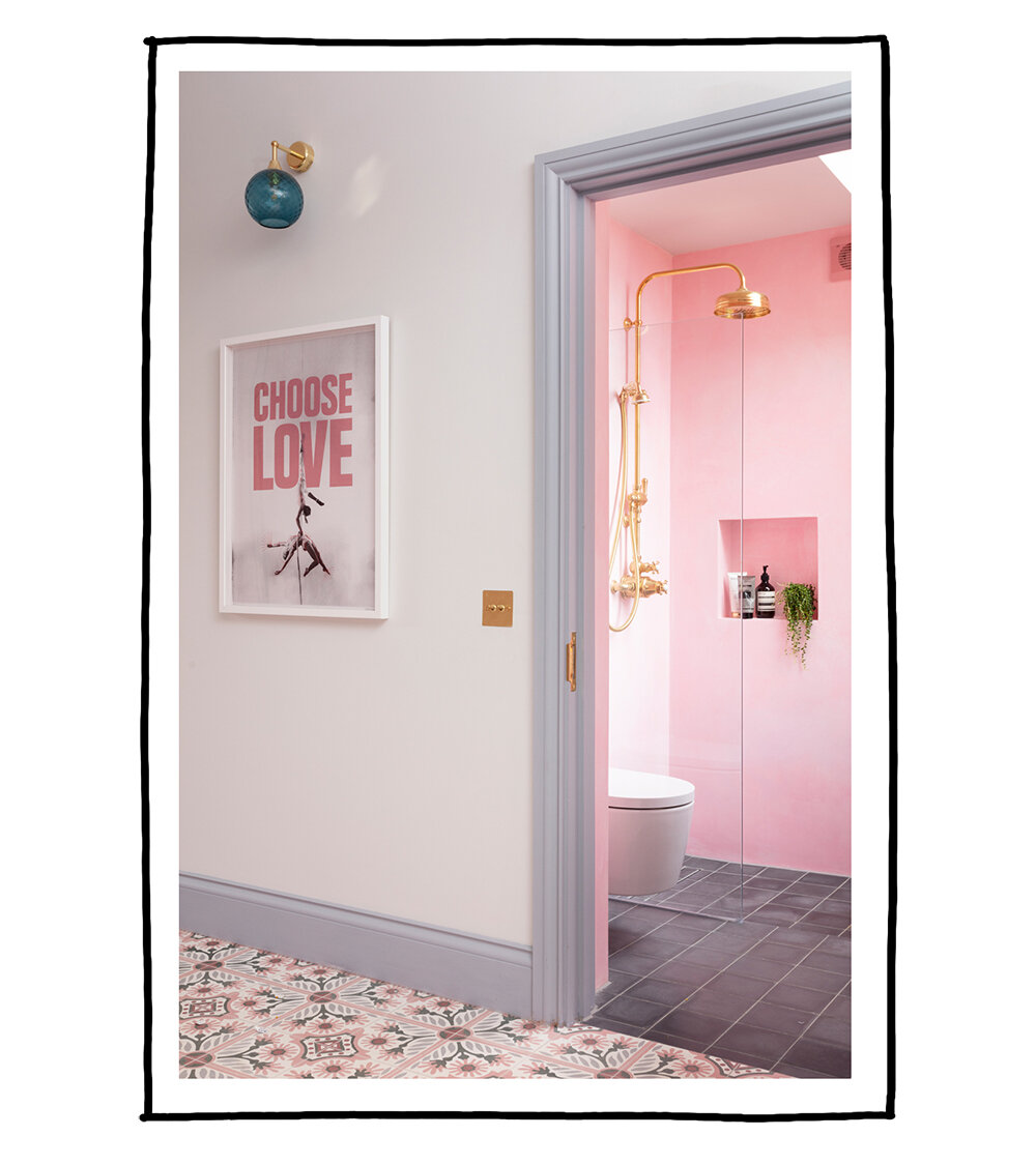Pink bathroom with tadelakt walls and brass shower, plus Choose Love print