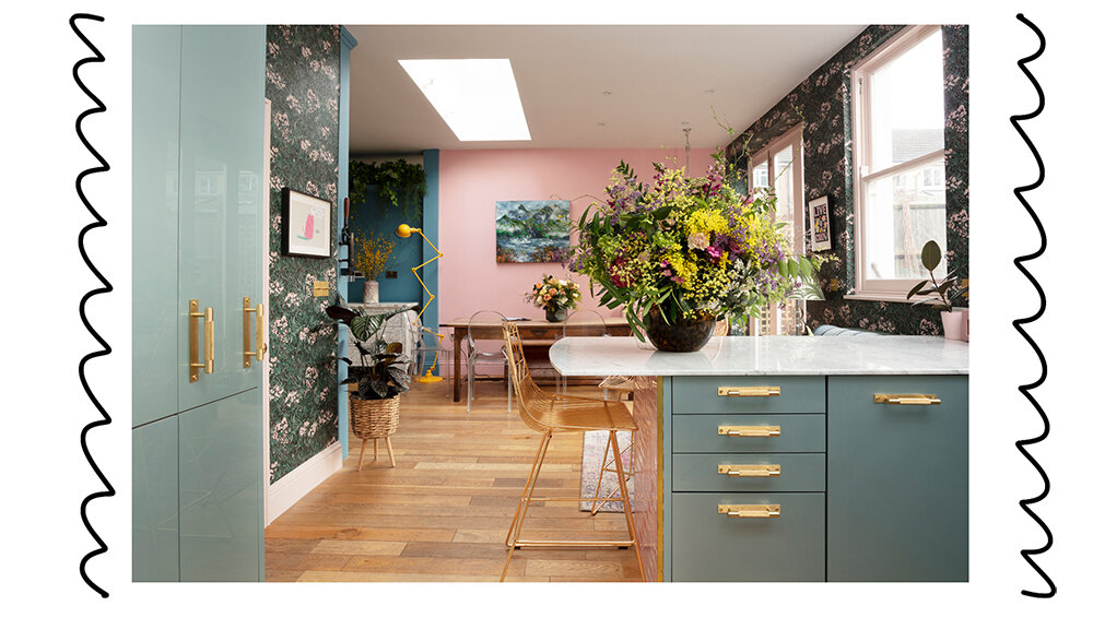 Pink and green kitchen with brass handles