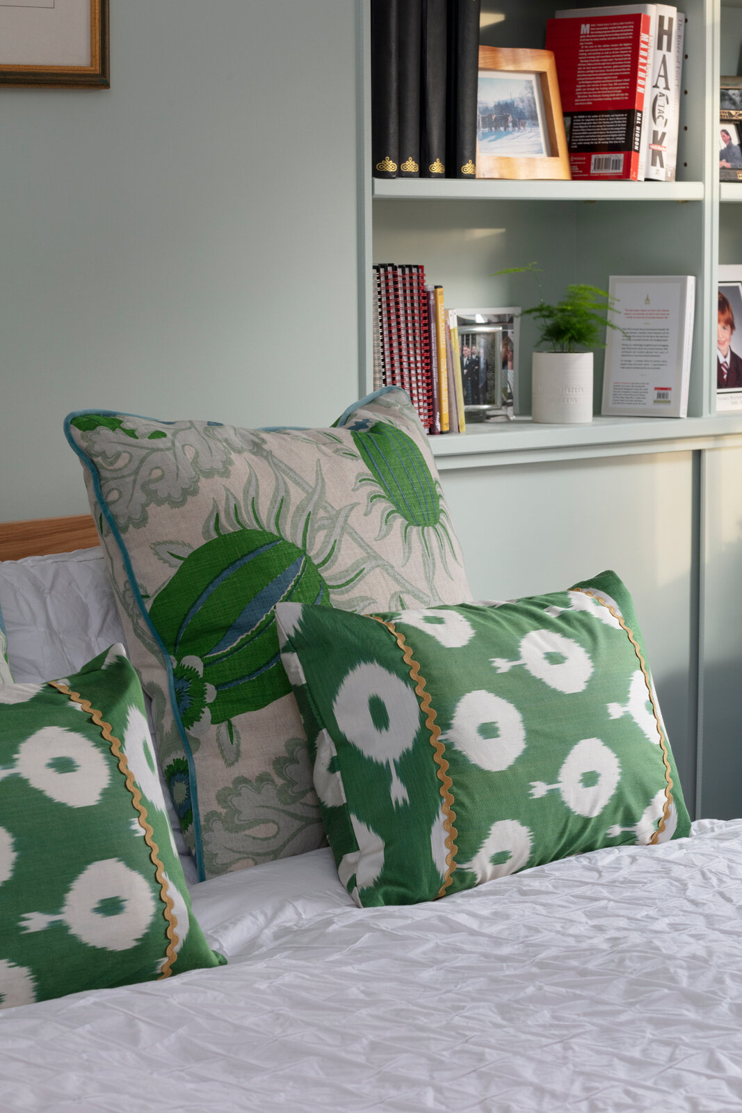 Cushions behind by The London Curtain Girls using Christopher Farr Carnival fabric/Green Ikat cushions from Polkra