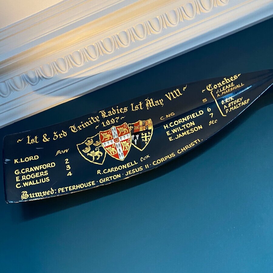 The rowing blade I won at Cambridge when I was ‘E Rogers’ now on display in my sitting room. The blue and yellow boat club colours were my inspiration for my second year room decor.