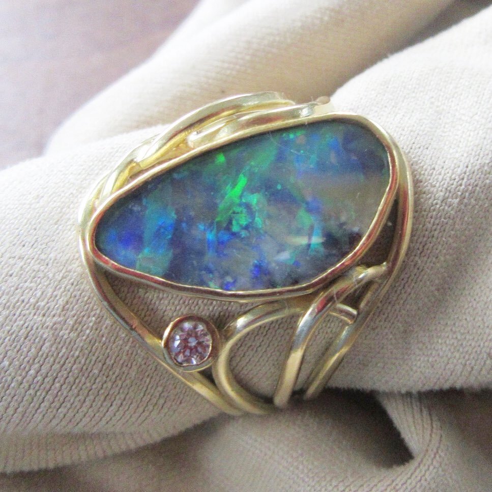 A new piece made with a stunning 4.02 carat boulder opal, diamond, 18k gold ring and 22k gold bezels. The opal was purchased from #opalfromwinton and the diamond is .07 carats. This piece is designed and created by Karen and available for sale 💎

.
