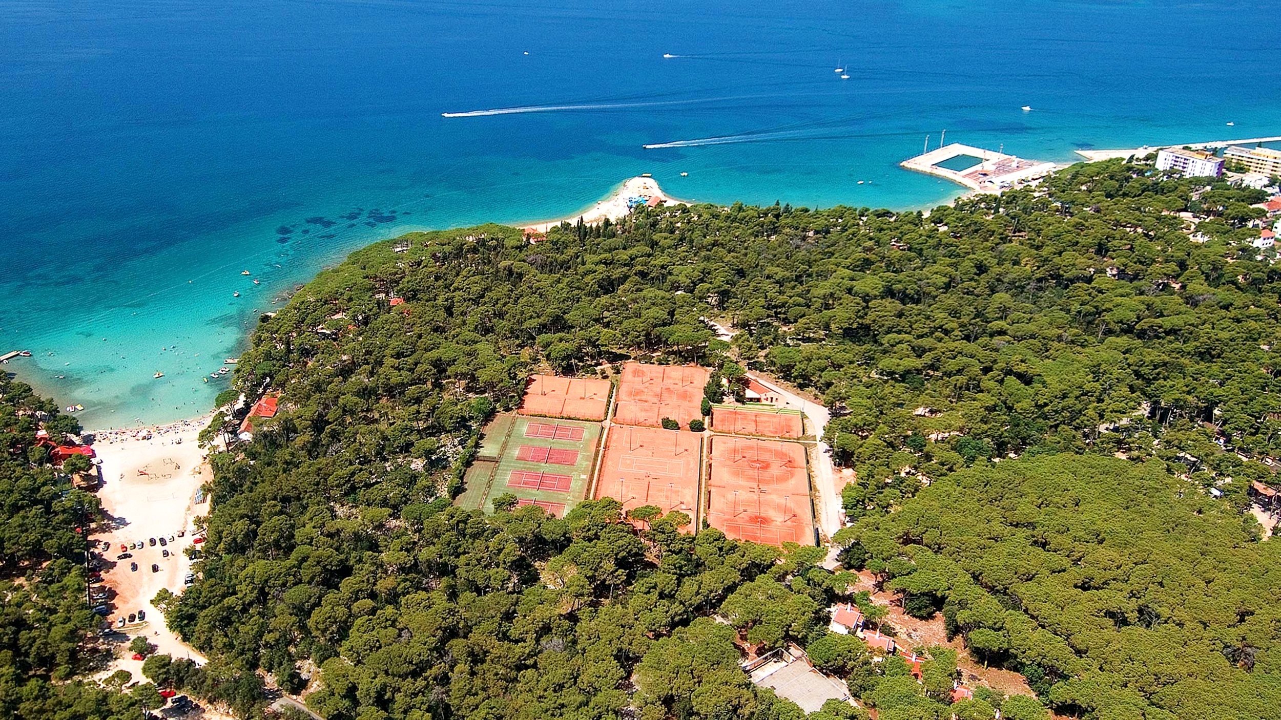 Sun soaked red clay tennis courts in Biograd na Moru, Zadar Region