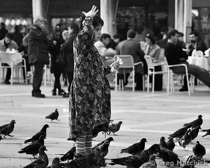 Girl With Pigeons in Piazza San Marco