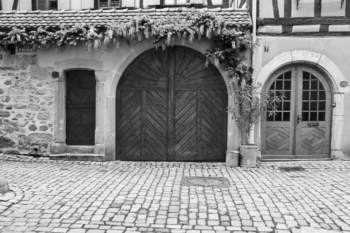 Cobblestones Doors and Wisteria in Alsace France