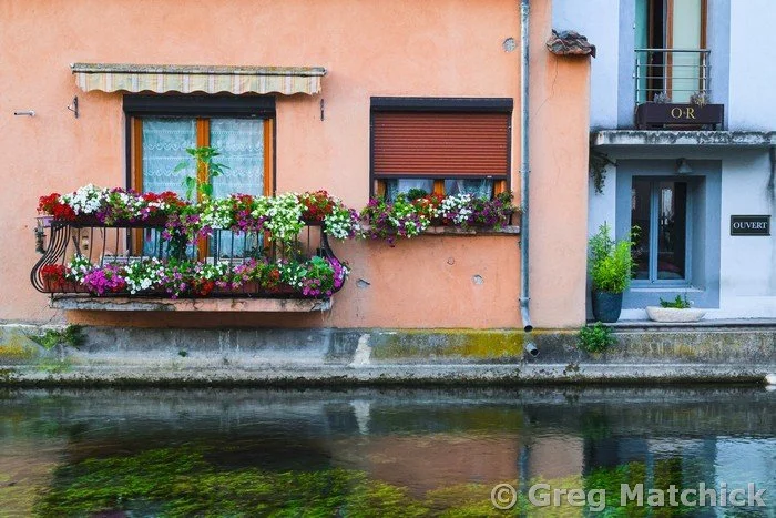 Balcony With Flowers Along the Canal in Isle Sur La Sorgue