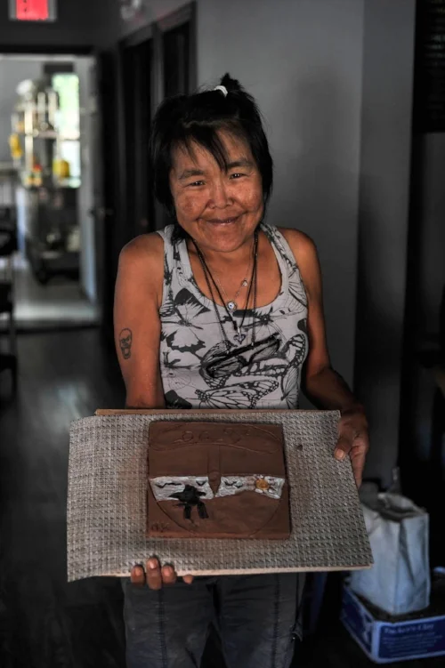 Nancy with her finished wet tile