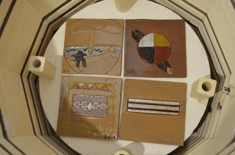 finished tiles....still burning hot from the kiln firing