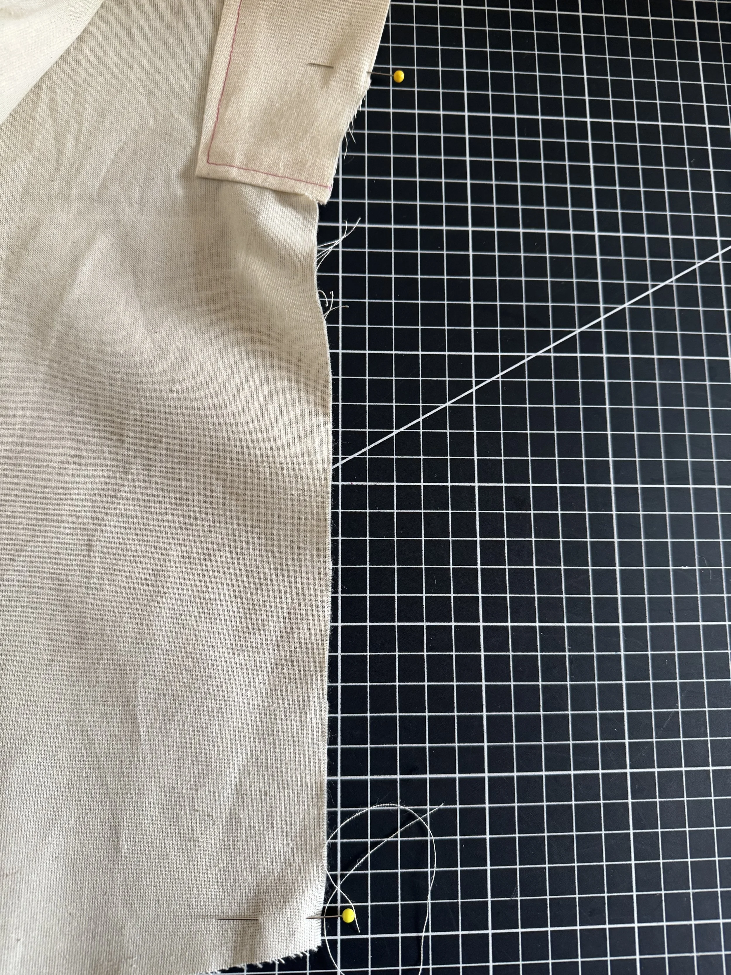 Place a pin where the curves end, and close to the edge of the hem.  These are your first match points.